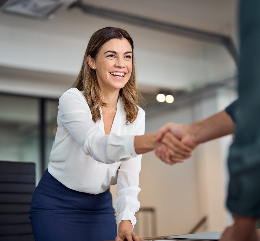 Happy,Mid,Aged,Business,Woman,Manager,Handshaking,Greeting,Client,In